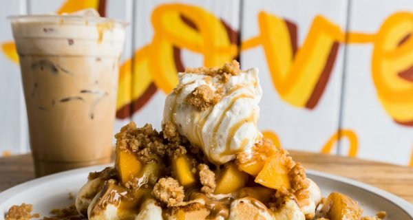 a white plate topped with waffles and ice cream