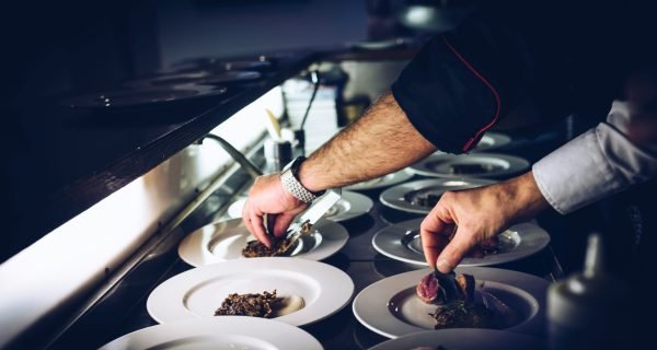 person preparing cooked dish