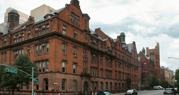 A city street with cars parked on the side of it