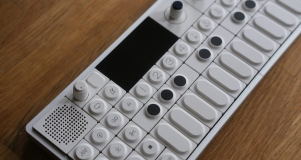 a remote control sitting on top of a wooden table