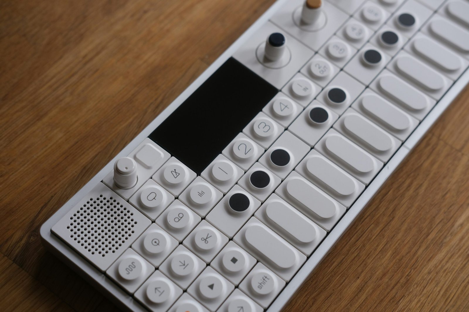 a remote control sitting on top of a wooden table