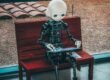 black and white robot toy on red wooden table