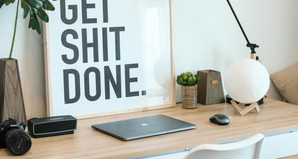 brown and white wooden desk with chair and laptop