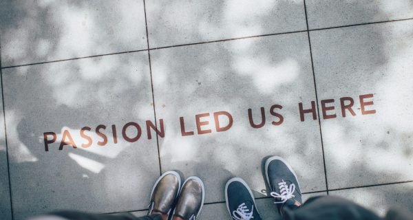 two person standing on gray tile paving