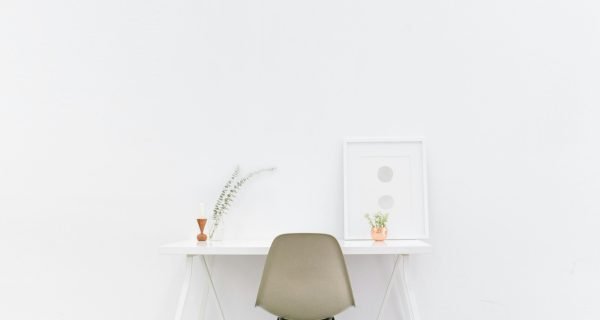 white wooden table near brown chair